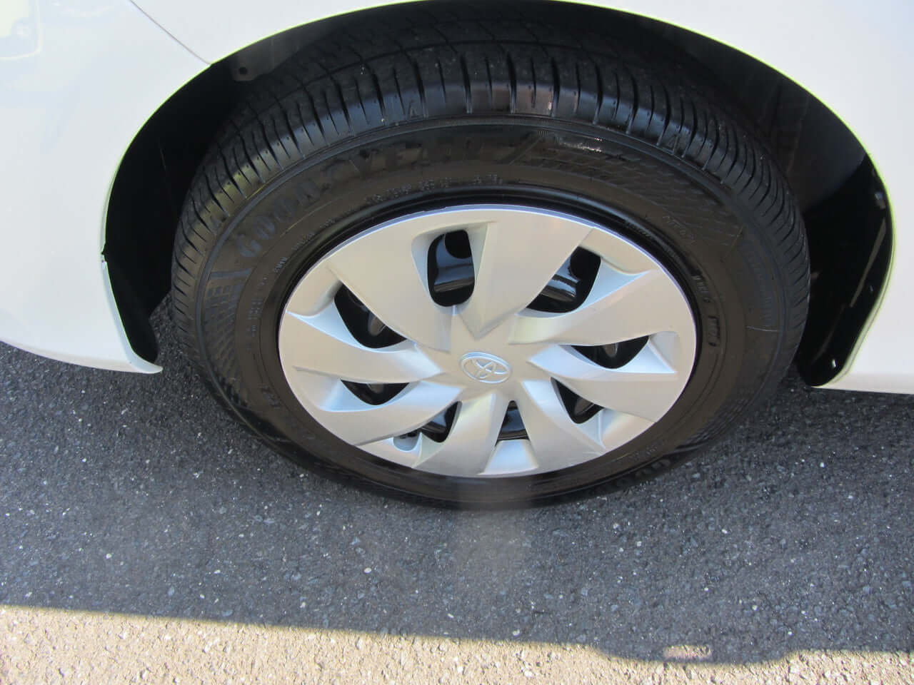 2018 Toyota Vitz 1.5L Hybrid wheel detail showcasing stylish design and tire condition.