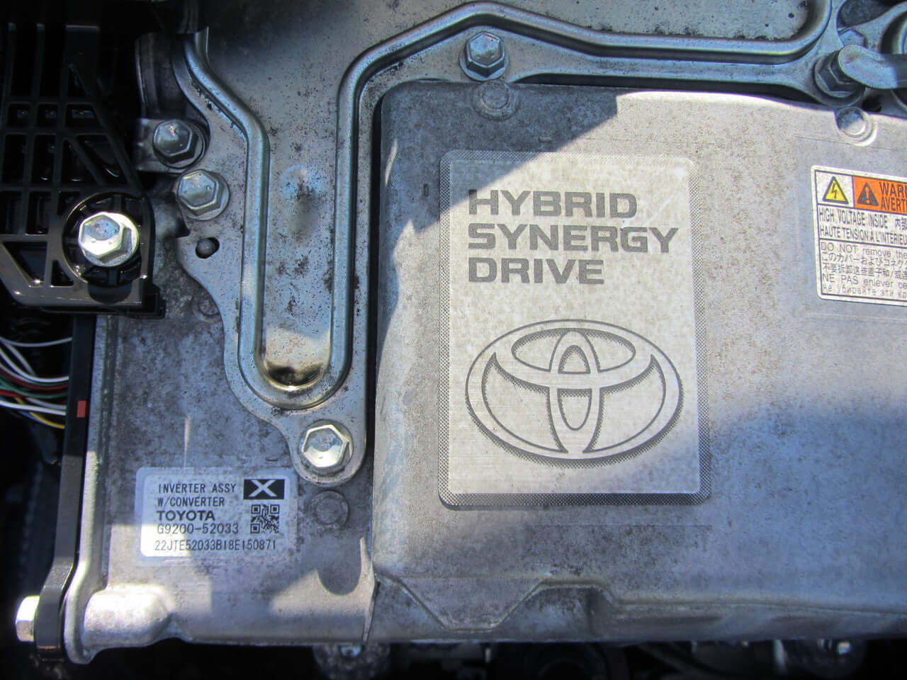 Hybrid Synergy Drive system in a 2018 Toyota Vitz 1.5L Hybrid engine compartment.