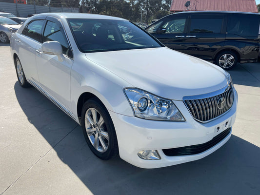 2009 Toyota Crown Majesta V8 4.6L C Type Luxury Sedan in white, showcasing its sleek exterior design and elegant features.