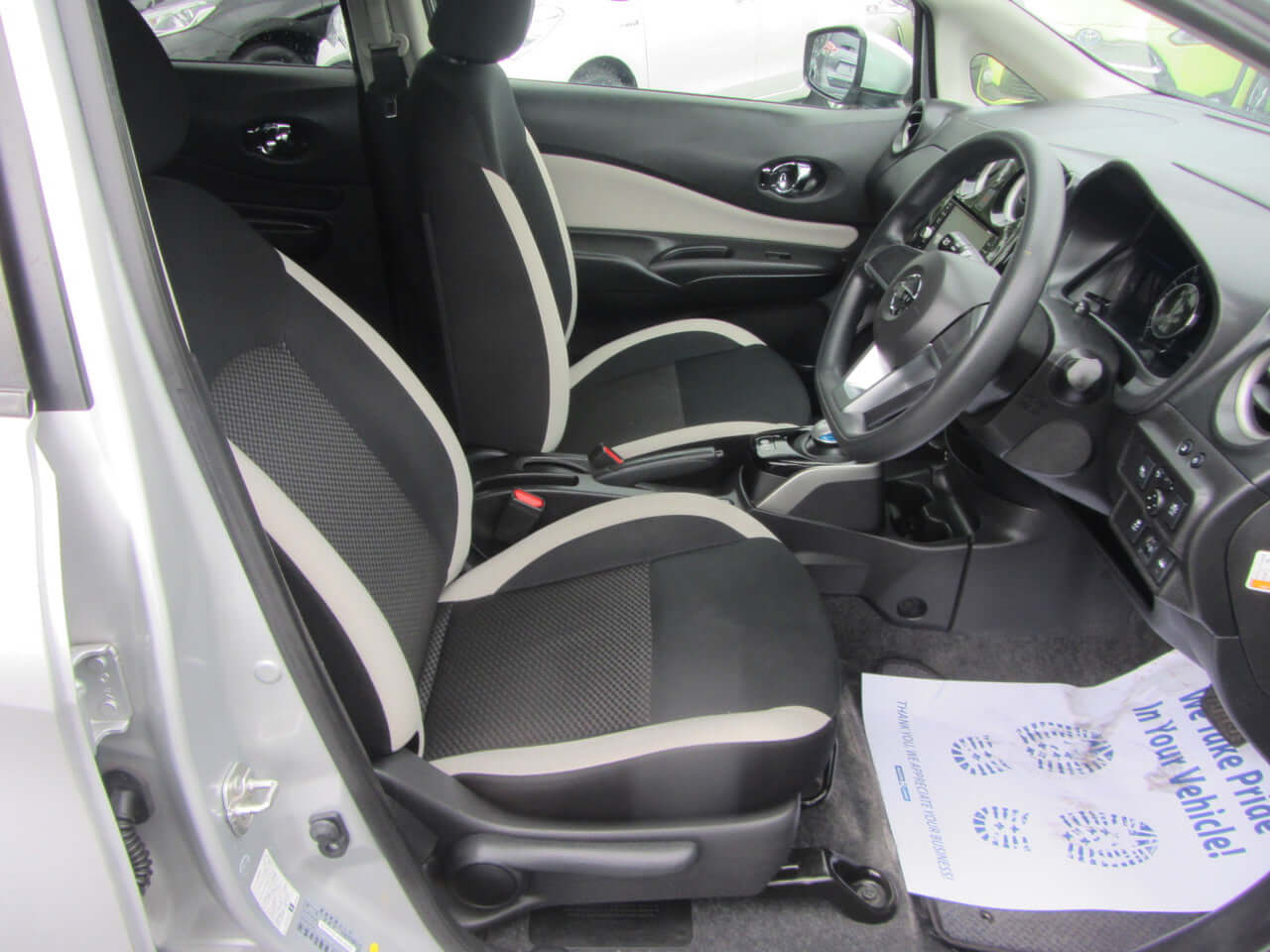 Interior view of the 2019 Nissan Note e-Power showing front seats and dashboard details.