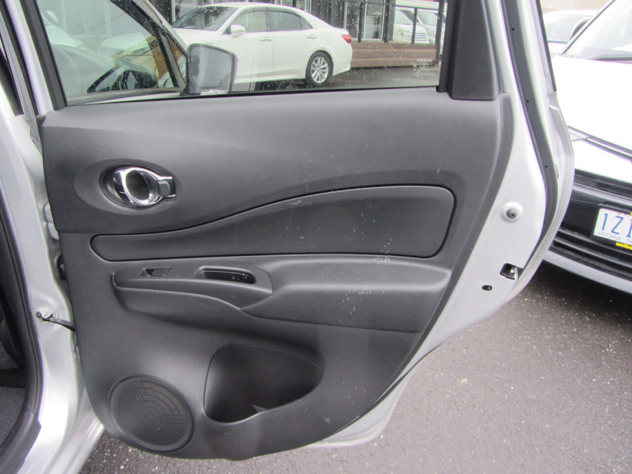 Interior view of the 2019 Nissan Note e-Power G Edition driver's side door, showcasing design and features.