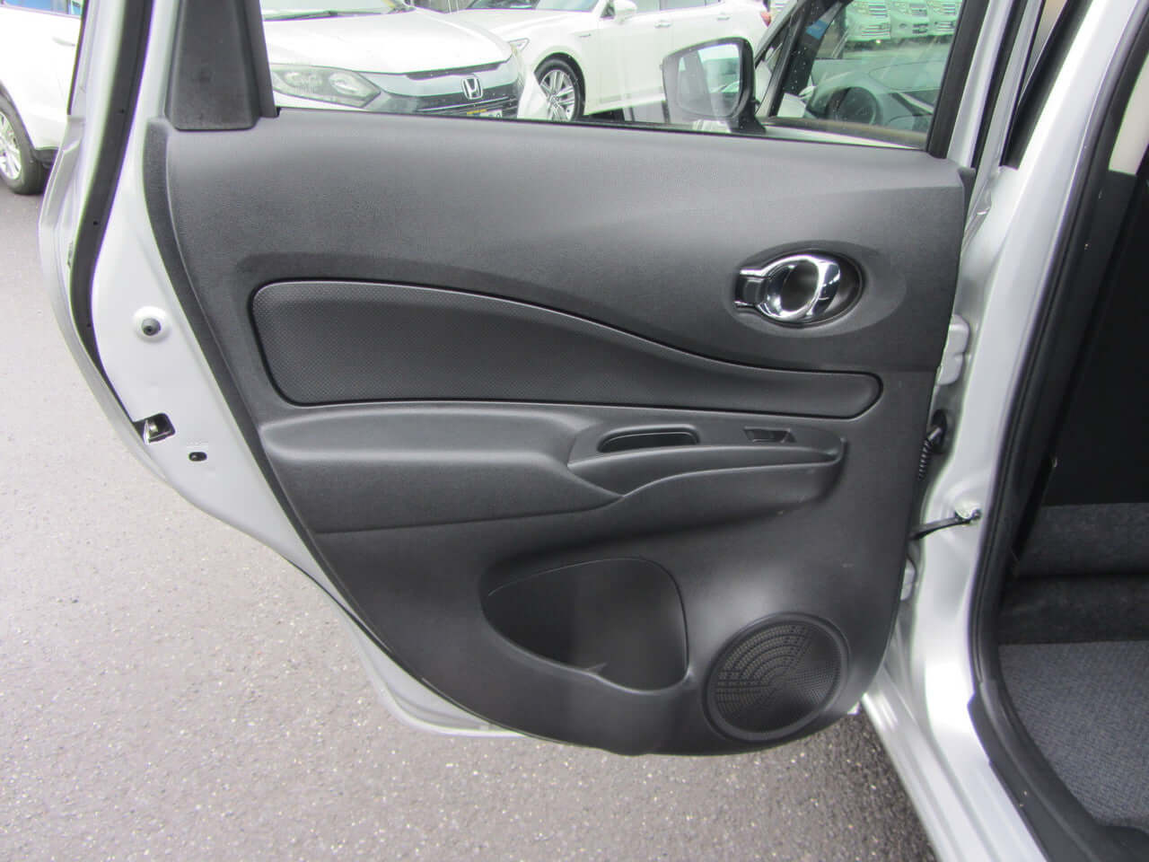 Inside view of the 2019 Nissan Note e-Power G Edition door panel showing design and features.