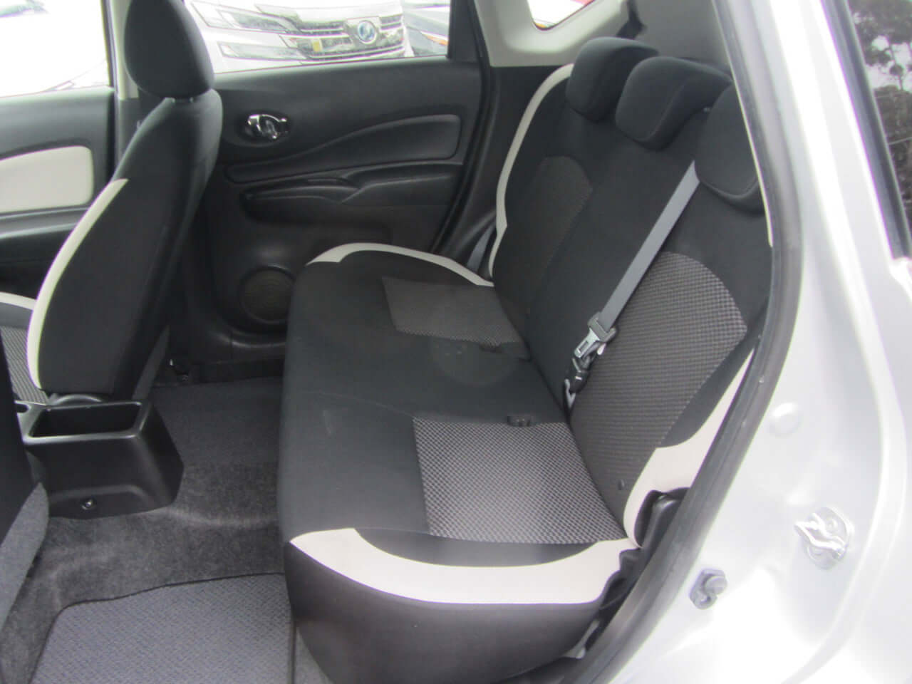 Interior view of the rear seating in a 2019 Nissan Note e-Power G Edition Hybrid, featuring comfortable fabric design.