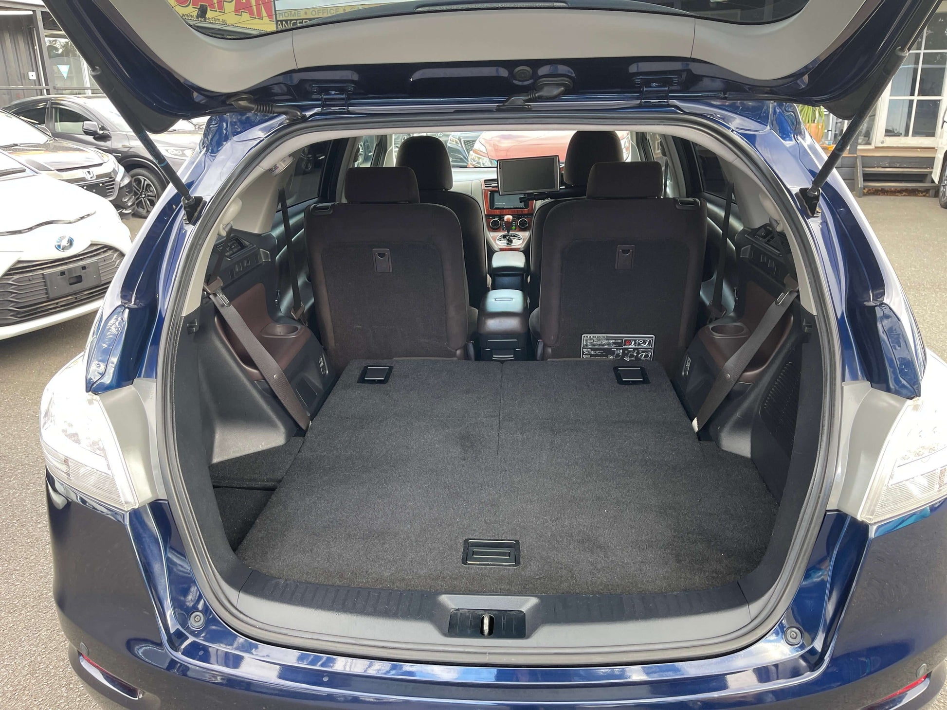2008 Toyota Mark X Zio V6 3.5L rear interior view showing spacious cargo area and seating for 6.