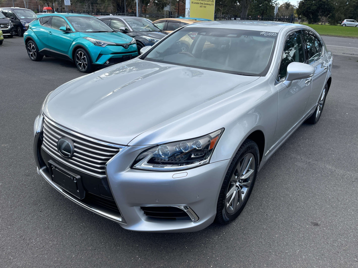 2015 Lexus LS460 AWD V8 4.6L Version L Premium Luxury Sedan parked in a lot with silver exterior.