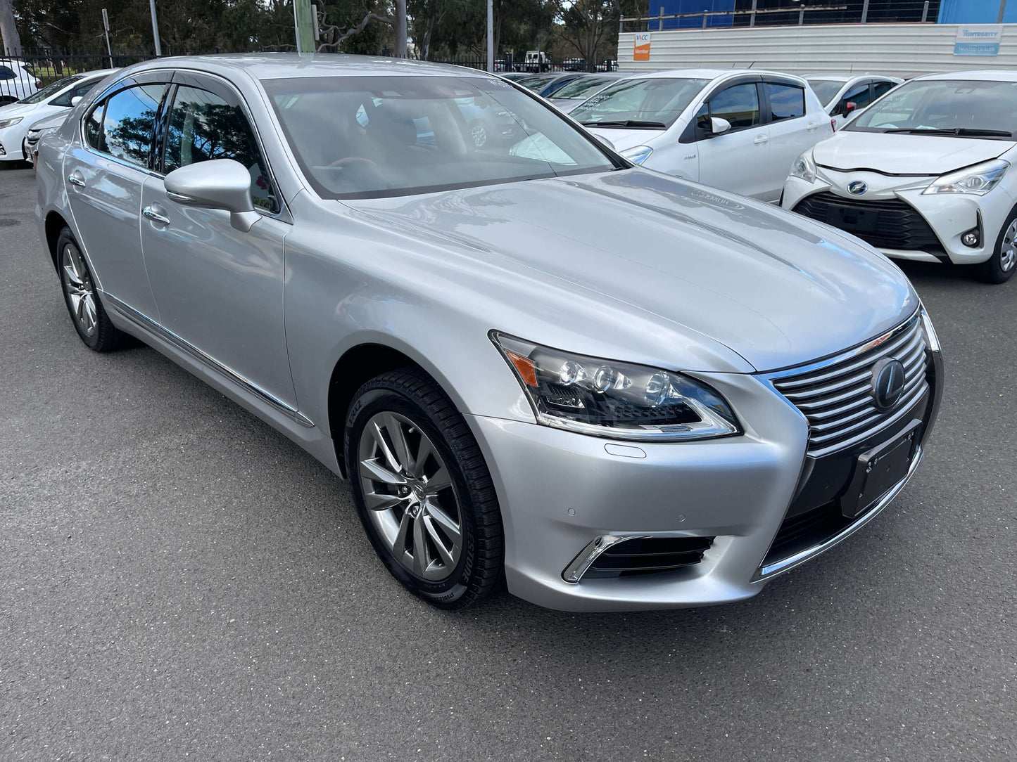 2015 Lexus LS460 AWD V8 4.6L Version L Premium Luxury Sedan in silver color parked outside.