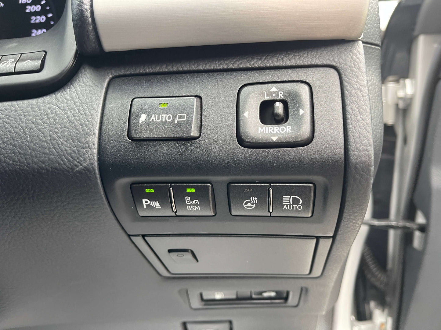 Interior controls of a 2015 Lexus LS460 AWD V8 4.6L, showcasing auto parking, mirror control, and other features.