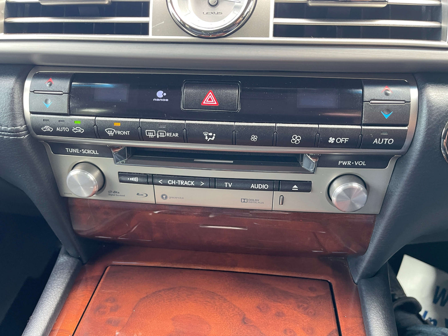 Interior control panel of a 2015 Lexus LS460 AWD V8 4.6L, featuring audio and climate controls.