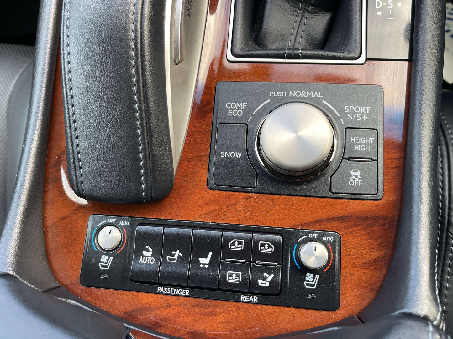 Interior controls and buttons of the 2015 Lexus LS460 AWD V8 4.6L luxury sedan, showing climate and driving modes.