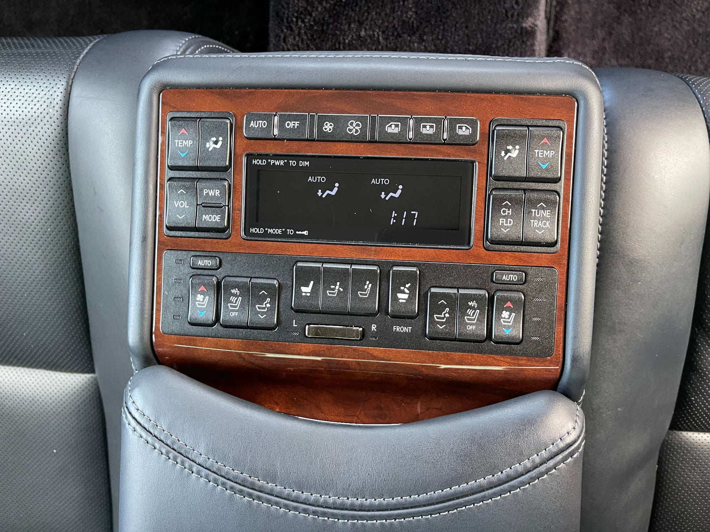 Interior controls of a 2015 Lexus LS460 AWD V8 4.6L, showcasing climate and audio settings.