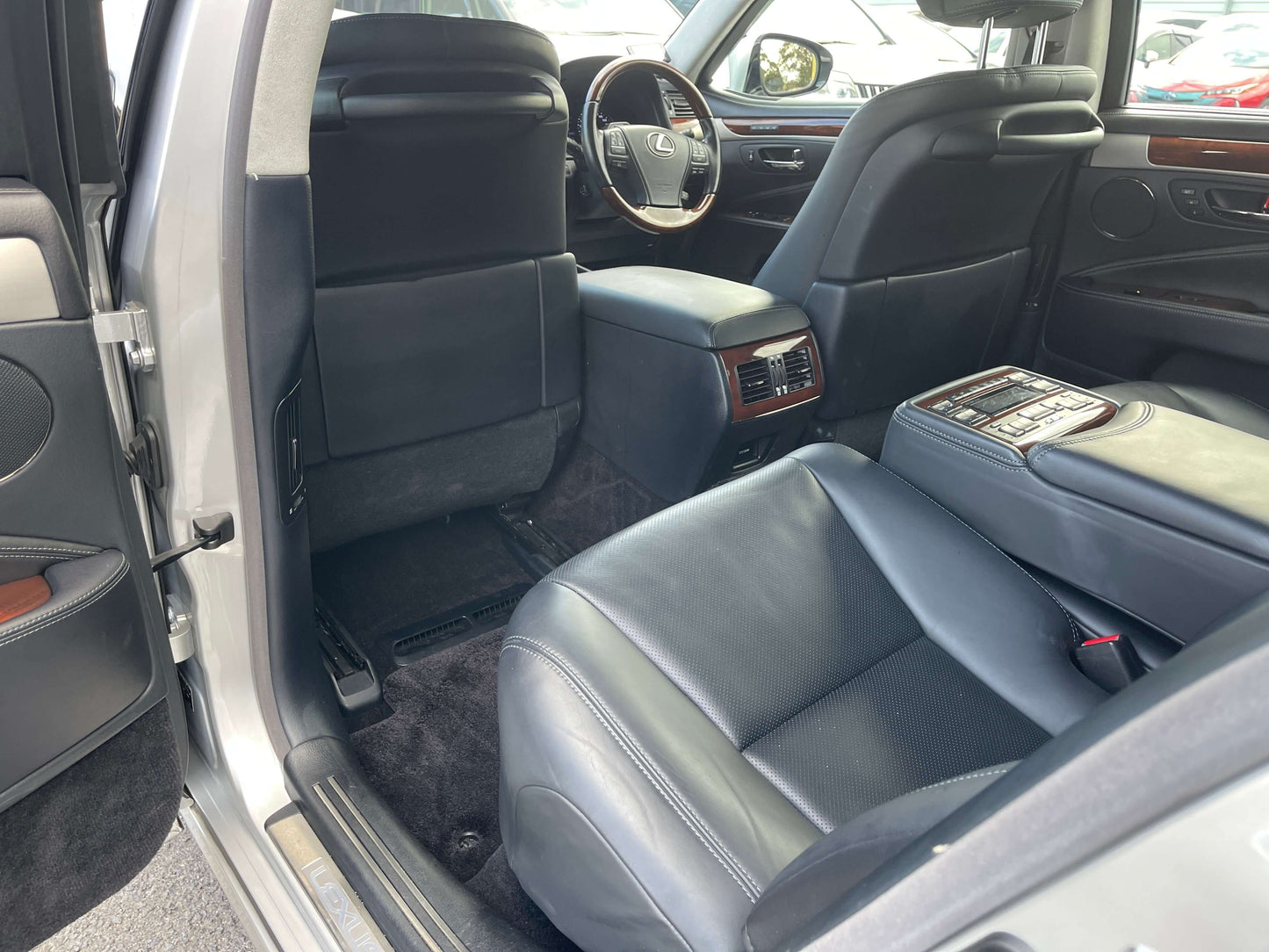 Interior view of a 2015 Lexus LS460 AWD V8 4.6L featuring leather seating and luxury design.