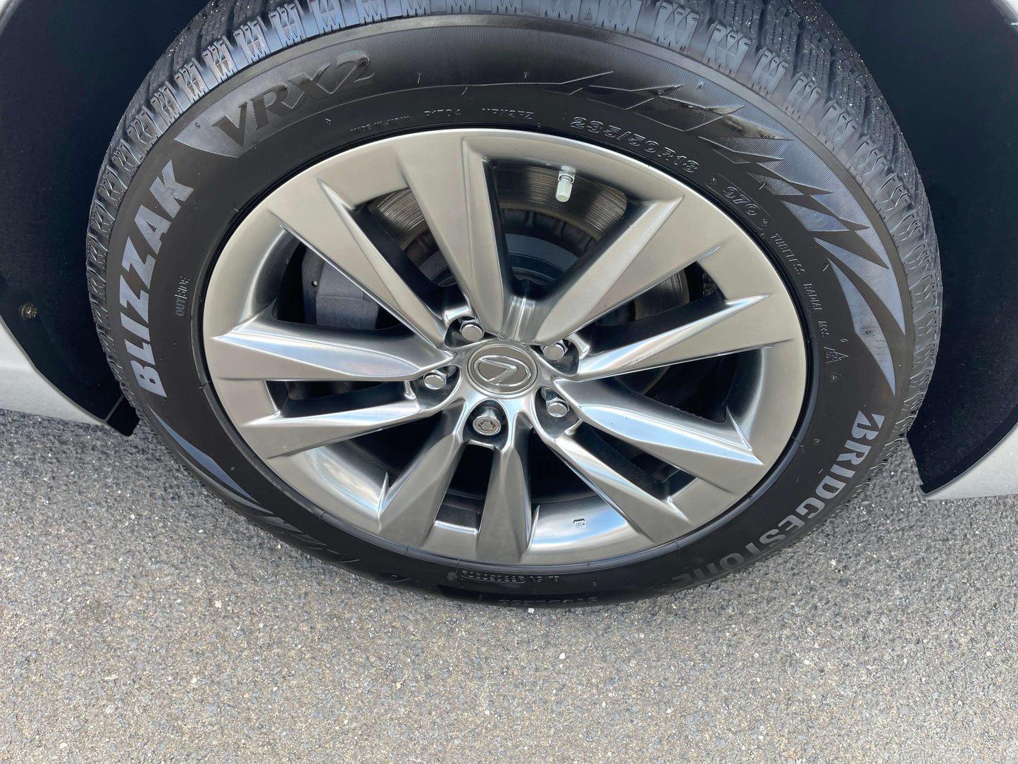 Close-up of a 2015 Lexus LS460 AWD V8 4.6L wheel with Bridgestone Blizzak tires.