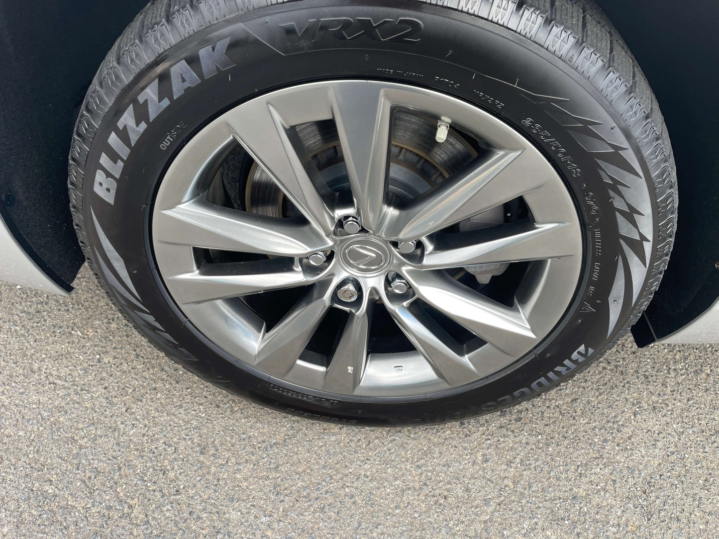 2015 Lexus LS460 AWD V8 4.6L stylish alloy wheel and Bridgestone Blizzak VRX2 tire, premium luxury sedan features.