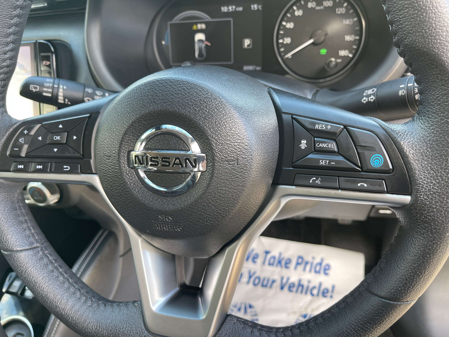 2020 Nissan Kicks e-Power steering wheel with controls and speedometer display.