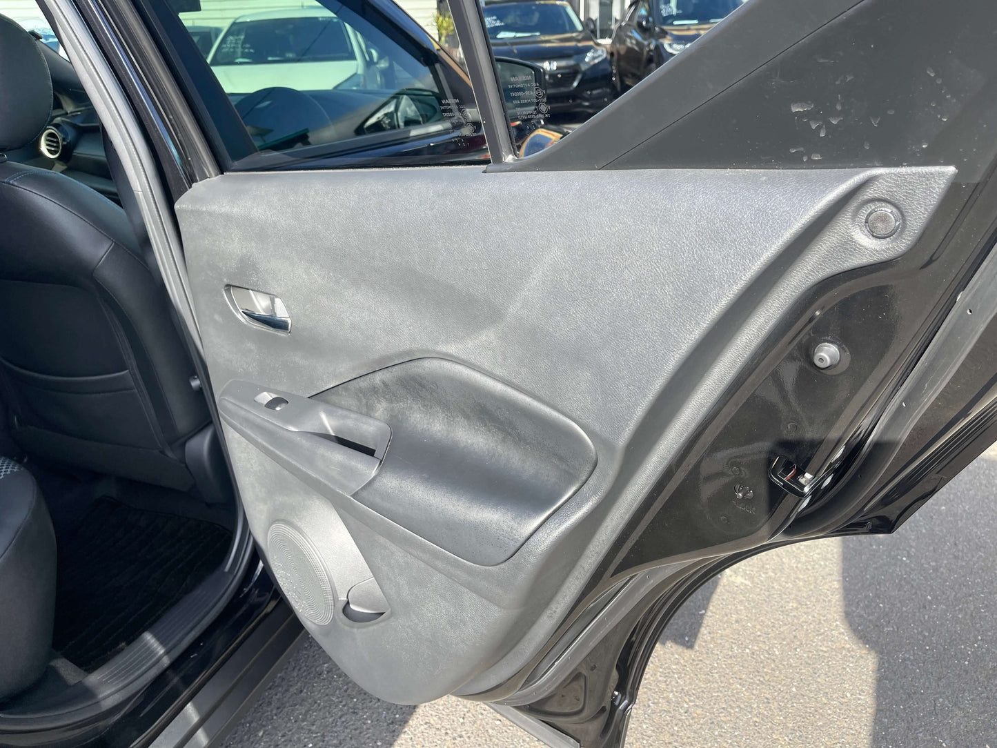 2020 Nissan Kicks e-Power X Edition interior door panel view, showcasing design and features.