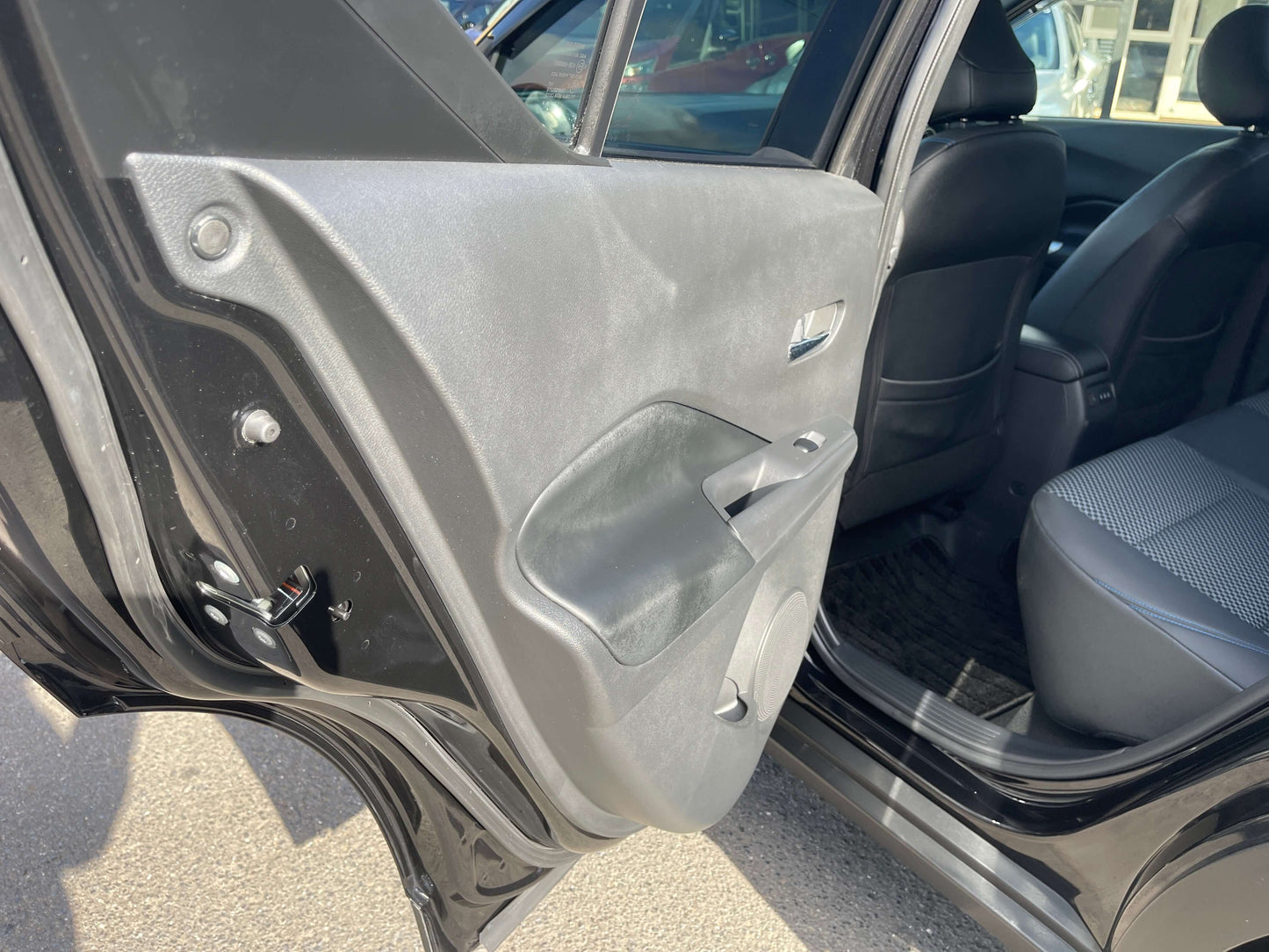 Interior view of the 2020 Nissan Kicks e-Power X Edition door panel showcasing sleek design.