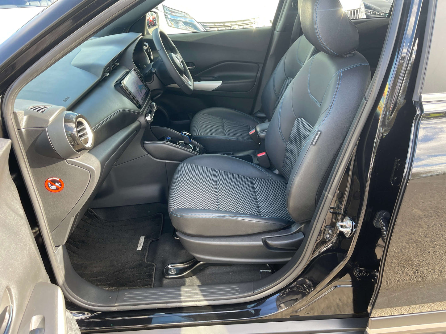 Interior view of the 2020 Nissan Kicks e-Power X Edition showing seats and dashboard.