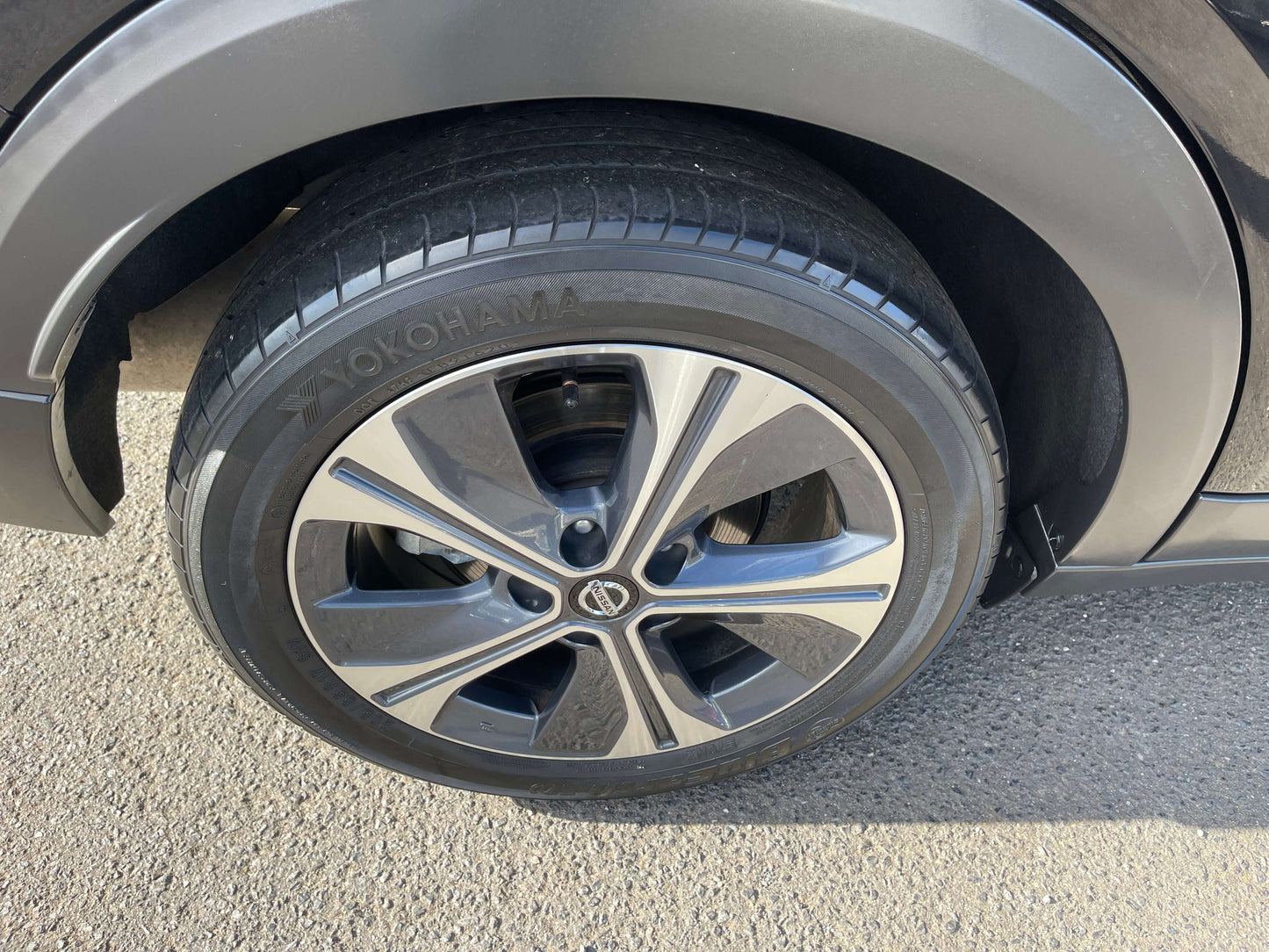 Close-up of a 2020 Nissan Kicks e-Power X Edition wheel, featuring Yokohama tire on a black vehicle.