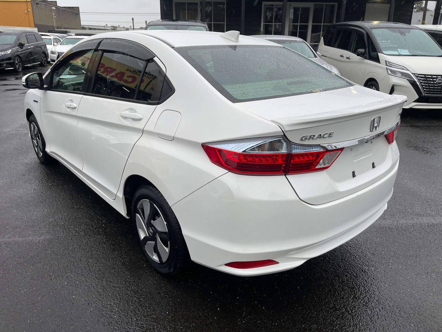2015 Honda Grace 1.5 Hybrid DX Sedan rear view, showcasing its sleek design and modern features.