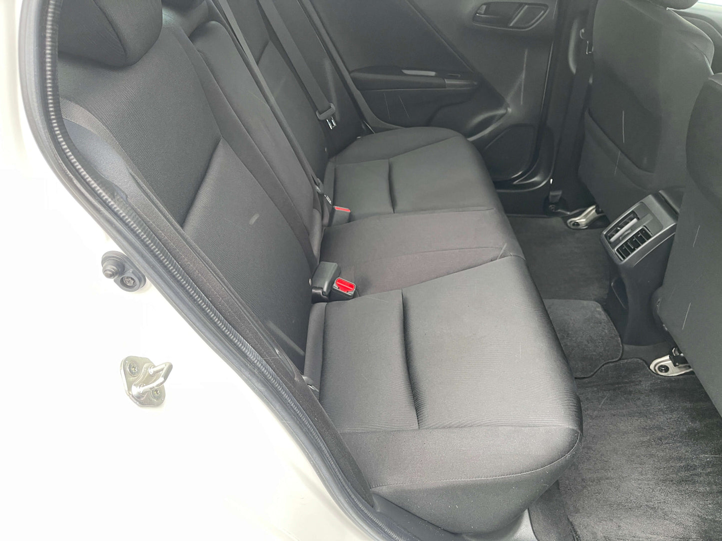 Interior view of the spacious rear seating area in a 2015 Honda Grace 1.5 Hybrid DX Sedan.