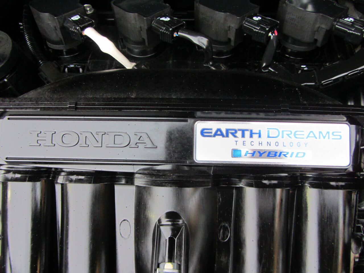 View of the Honda engine featuring Earth Dreams technology for the 2017 Honda Fit 1.5L Hybrid.