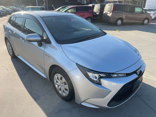 2019 Toyota Corolla Touring 1.8 4WD Hybrid G-X Station Wagon in silver with sleek design and alloy wheels.