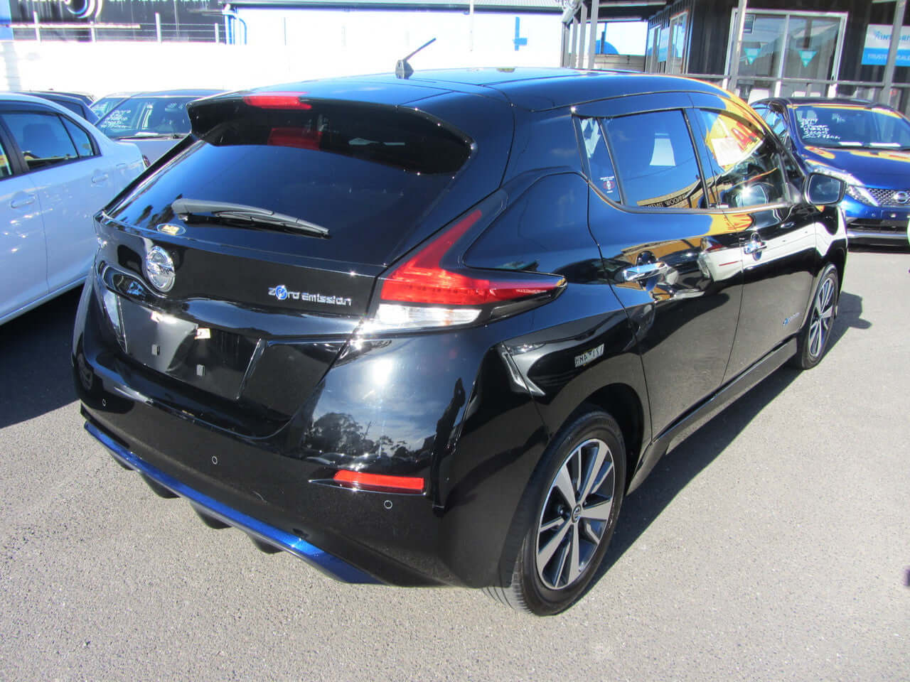 2019 Nissan Leaf e+ 62kW X-Edition Full Electric vehicle rear view, showing sleek black design and modern features.