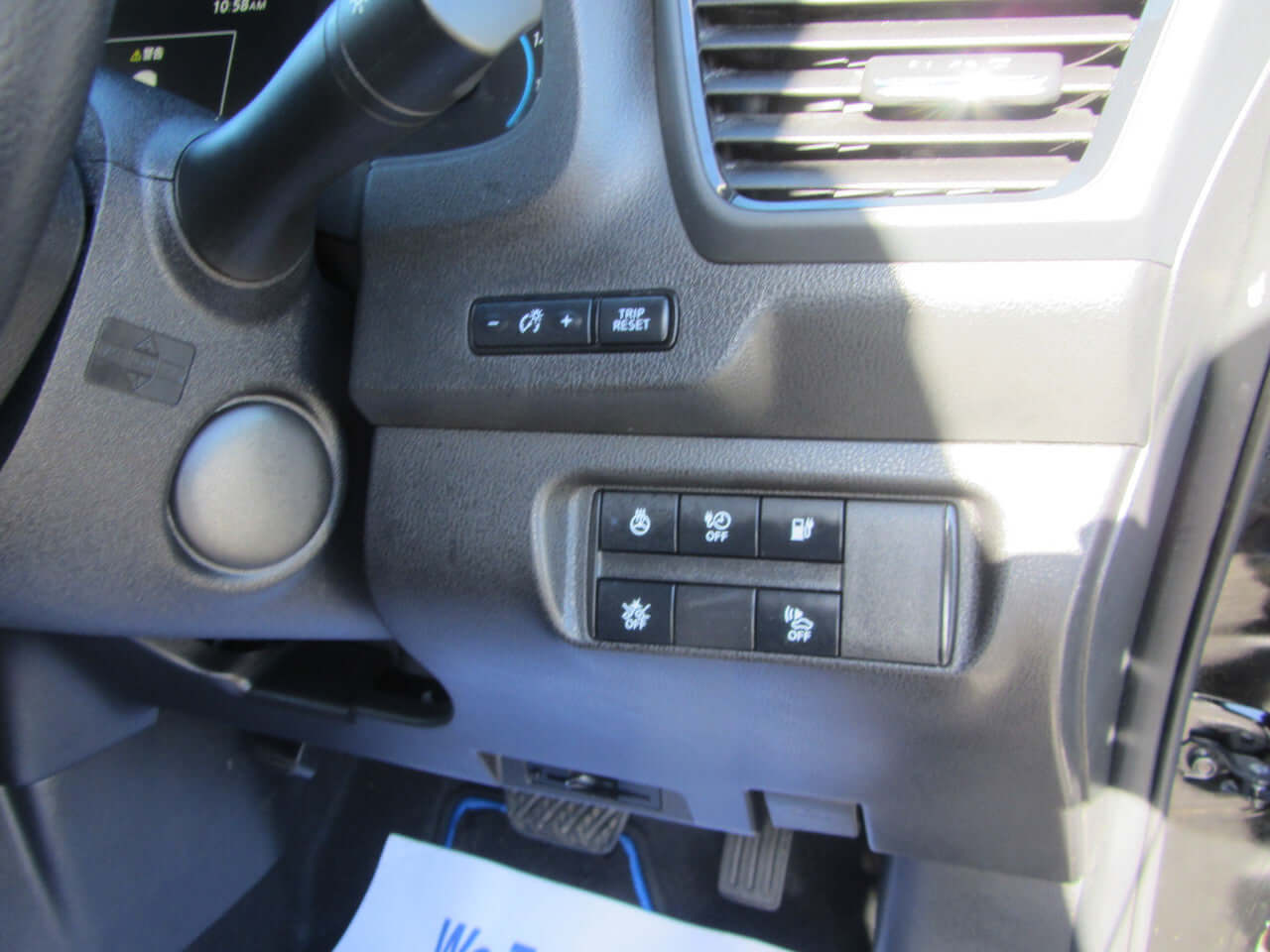 Close-up view of dashboard controls in 2019 Nissan Leaf e+ 62kW X-Edition Full Electric, showcasing convenience features.