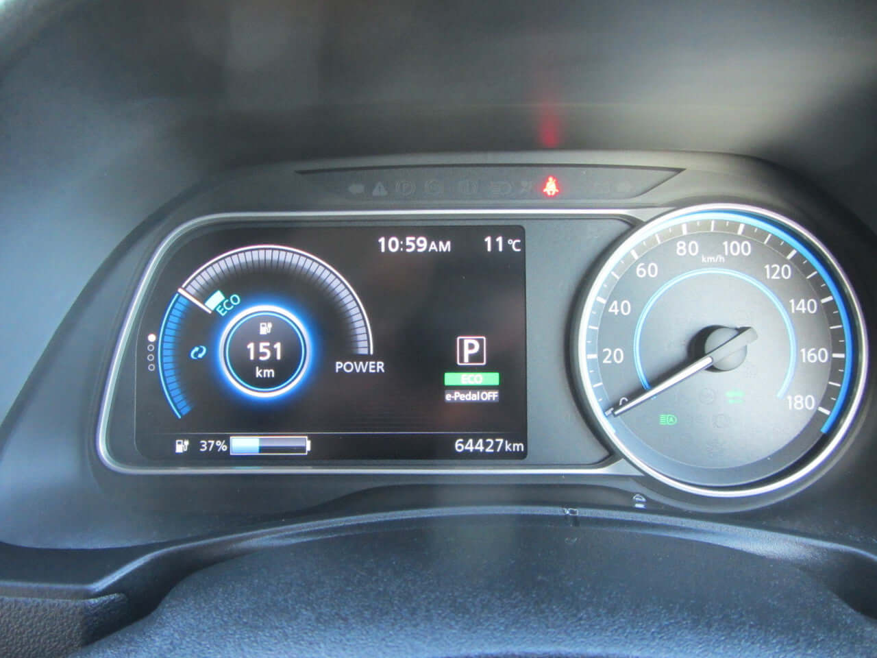 2019 Nissan Leaf e+ 62kW X-Edition Full Electric dashboard display showing power and mileage at 64427 km.