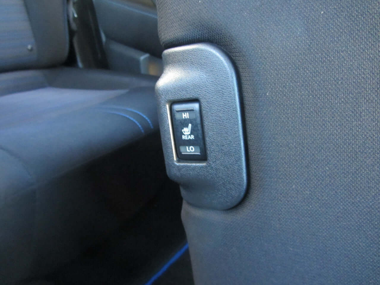 Heated rear seat control switch in 2019 Nissan Leaf e+ 62kW X-Edition Full Electric.