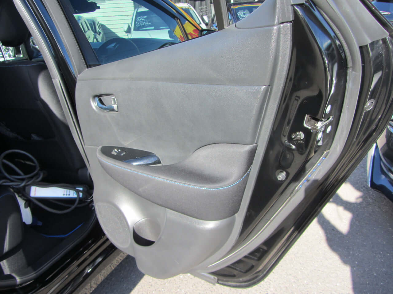2019 Nissan Leaf e+ 62kW X-Edition Full Electric interior door panel showing features and design.