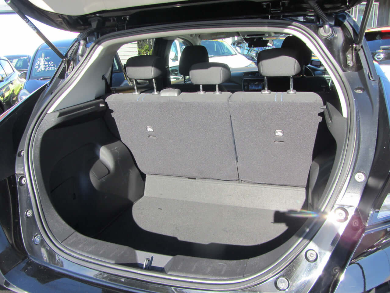 2019 Nissan Leaf e+ 62kW X-Edition Full Electric rear seating and cargo area with seats folded down.
