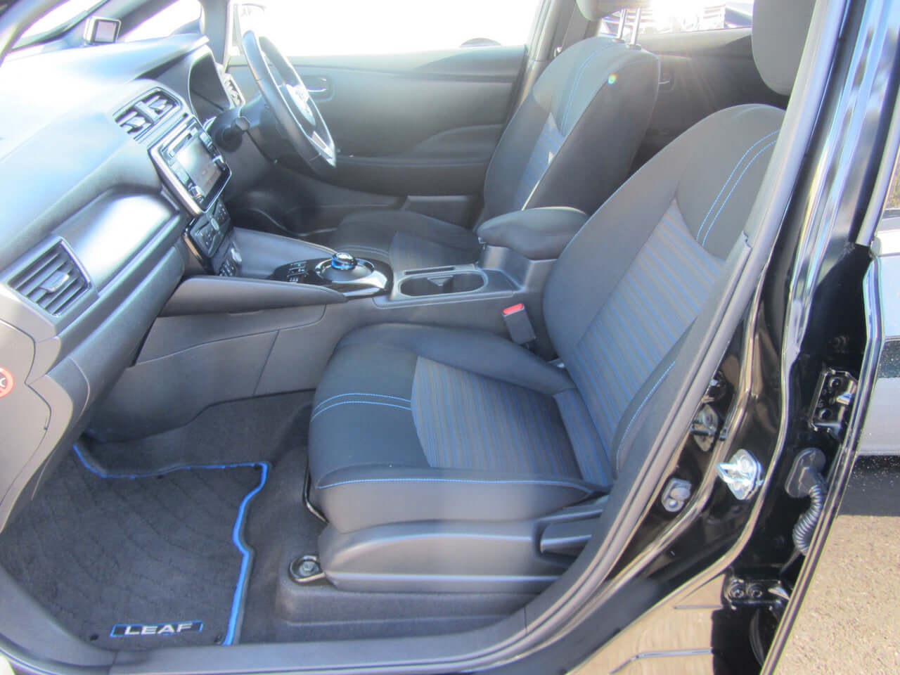 Interior view of 2019 Nissan Leaf e+ 62kW X-Edition Full Electric showcasing comfortable seating and dashboard.