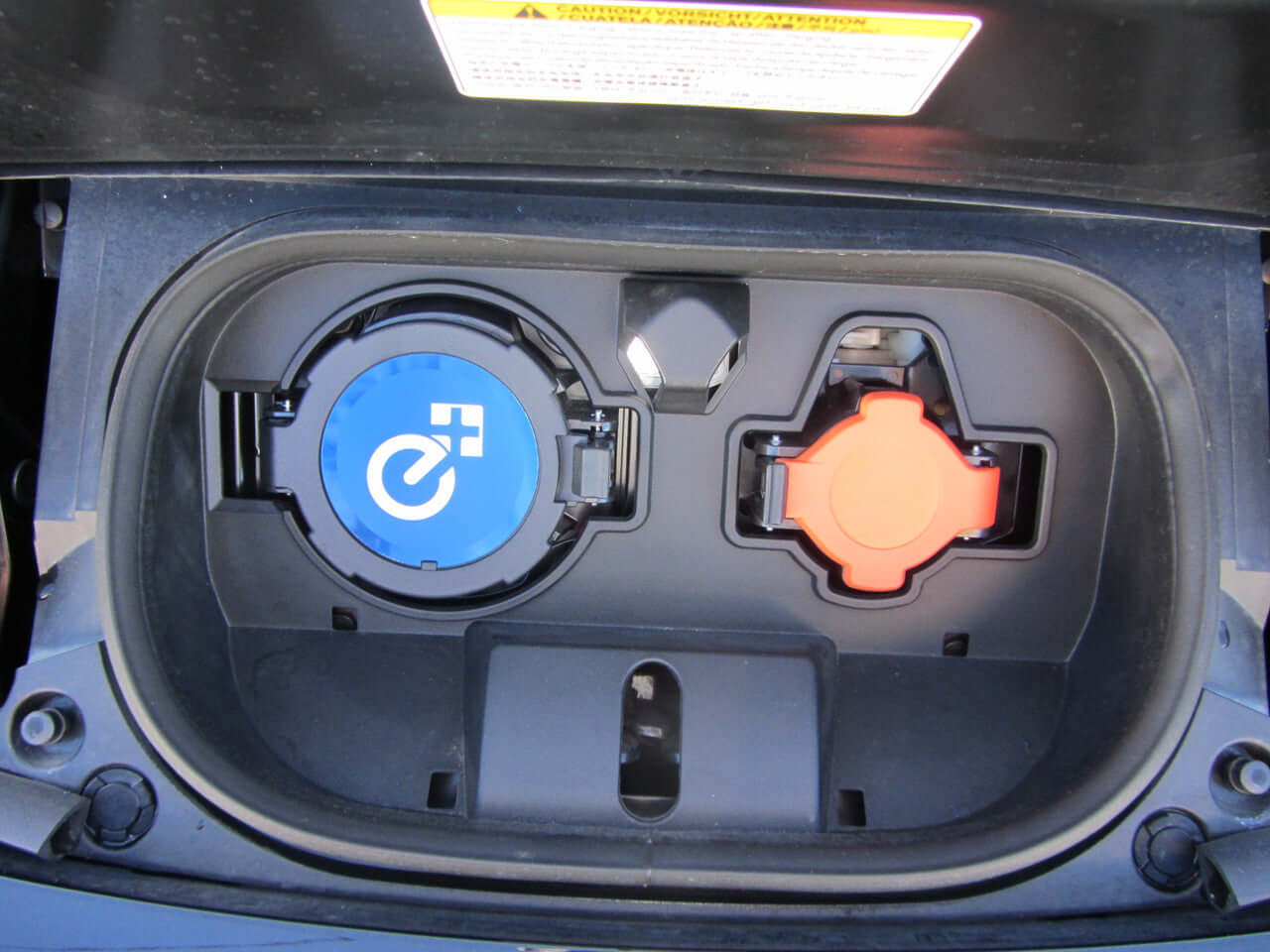 Close-up view of the charging port of a 2019 Nissan Leaf e+ 62kW X-Edition Full Electric.