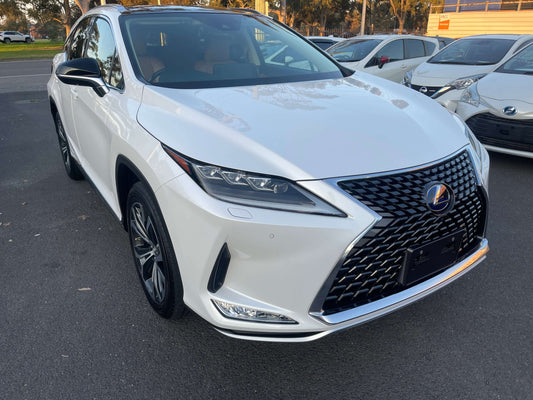 2020 Lexus RX450H V6 3.5L Hybrid luxury SUV in white color, showcasing premium design and front grille.