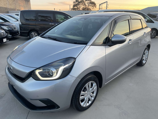 2020 Honda Fit 1.5 eHEV Home Edition hybrid hatchback in silver with modern design and spacious interior.