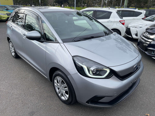 2020 Honda Fit 1.5 eHEV Home Edition compact hatchback in silver color, showcasing modern design and efficiency.