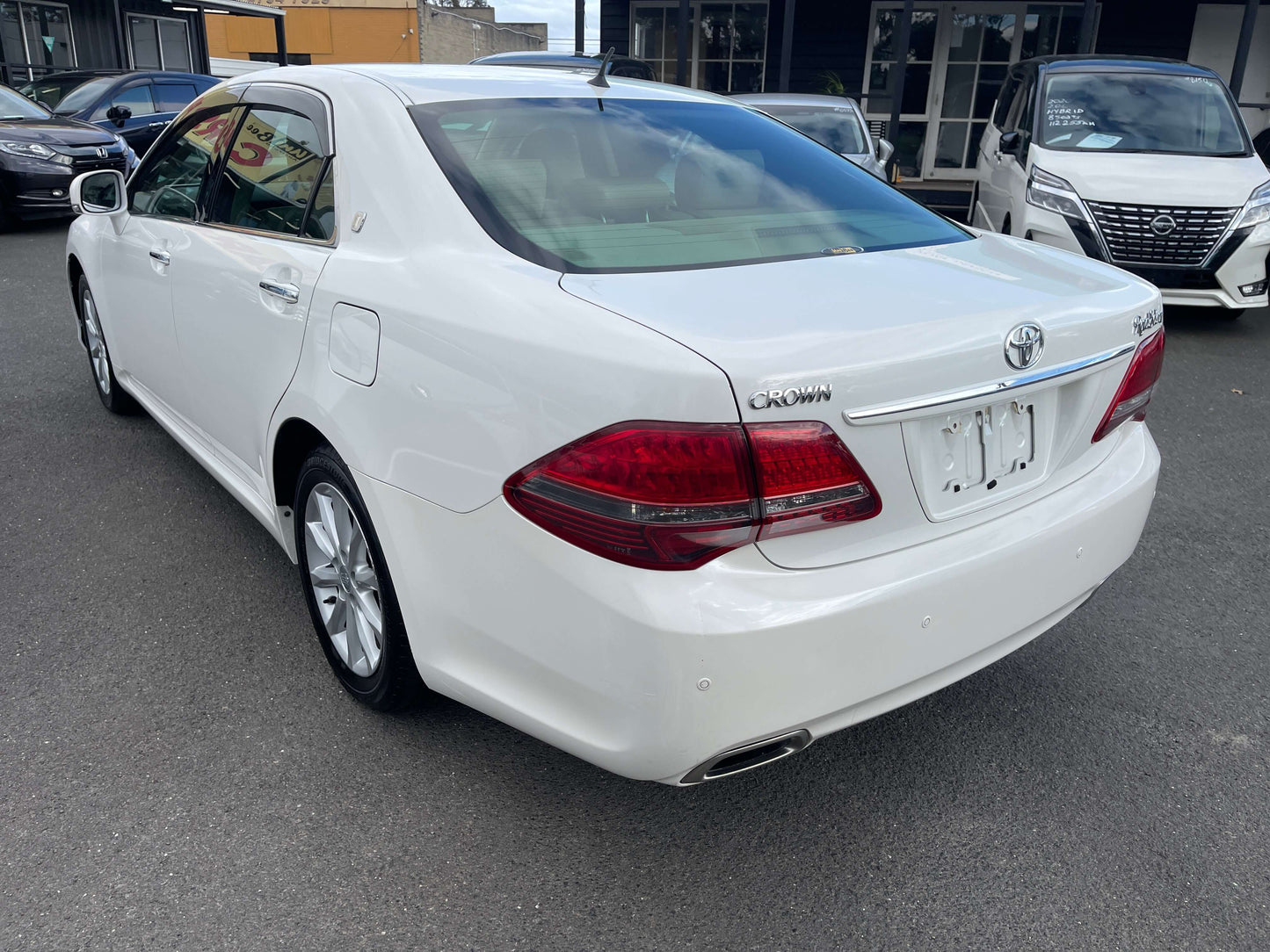 2008 Toyota Crown V6 3.0L Royal Saloon Luxury Sedan rear view, sleek white design and modern features.
