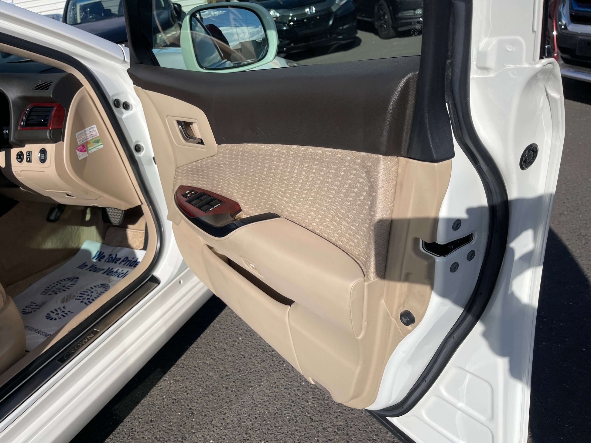 Interior view of the 2008 Toyota Crown V6 3.0L Royal Saloon Luxury Sedan door panel featuring premium materials.