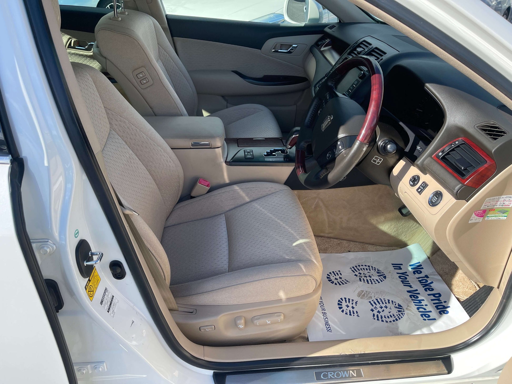 Interior view of 2008 Toyota Crown V6 3.0L Royal Saloon Luxury Sedan showing plush seats and dashboard.