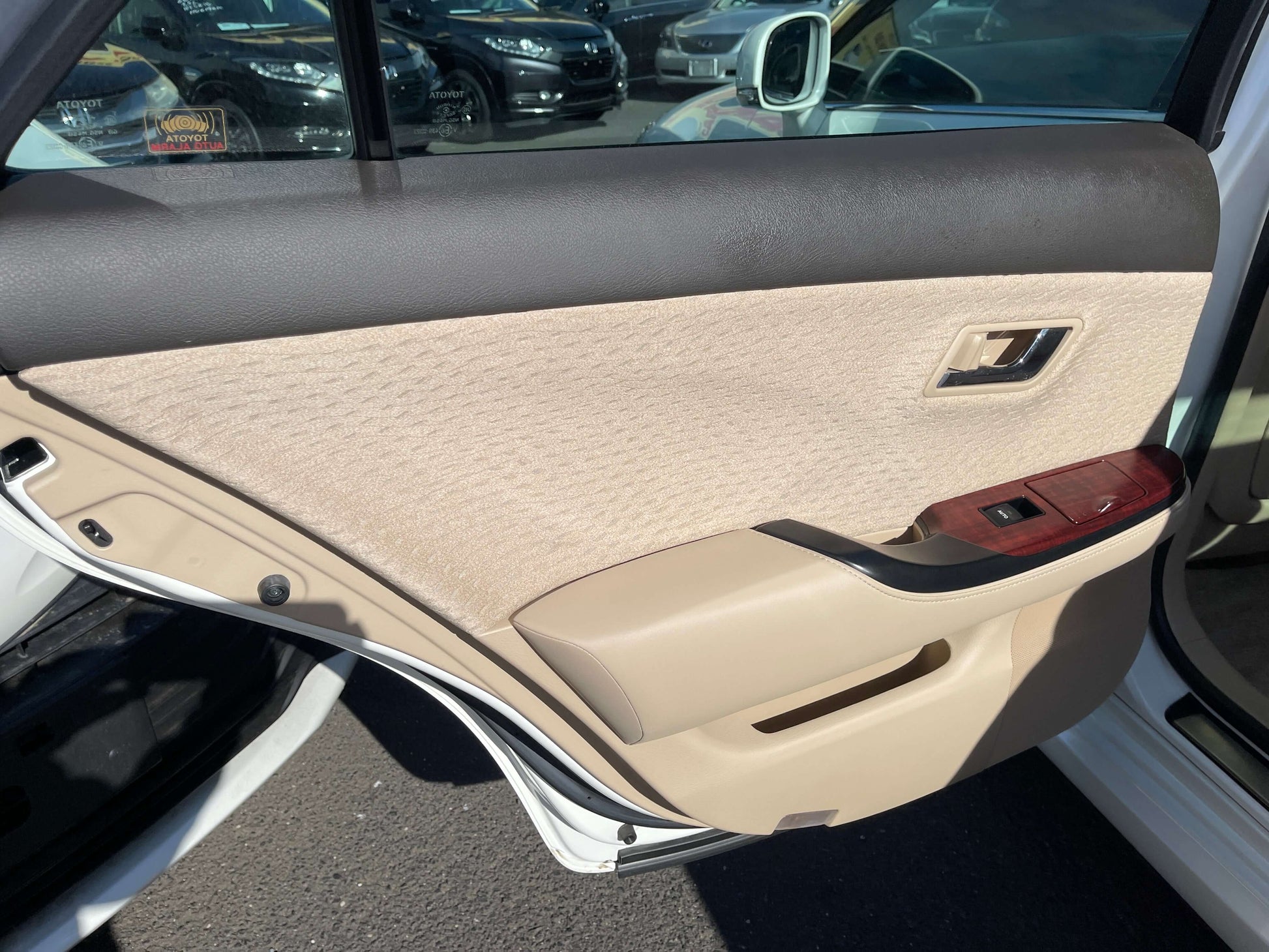 2008 Toyota Crown V6 3.0L luxury sedan interior door design showcasing beige and black detailing.