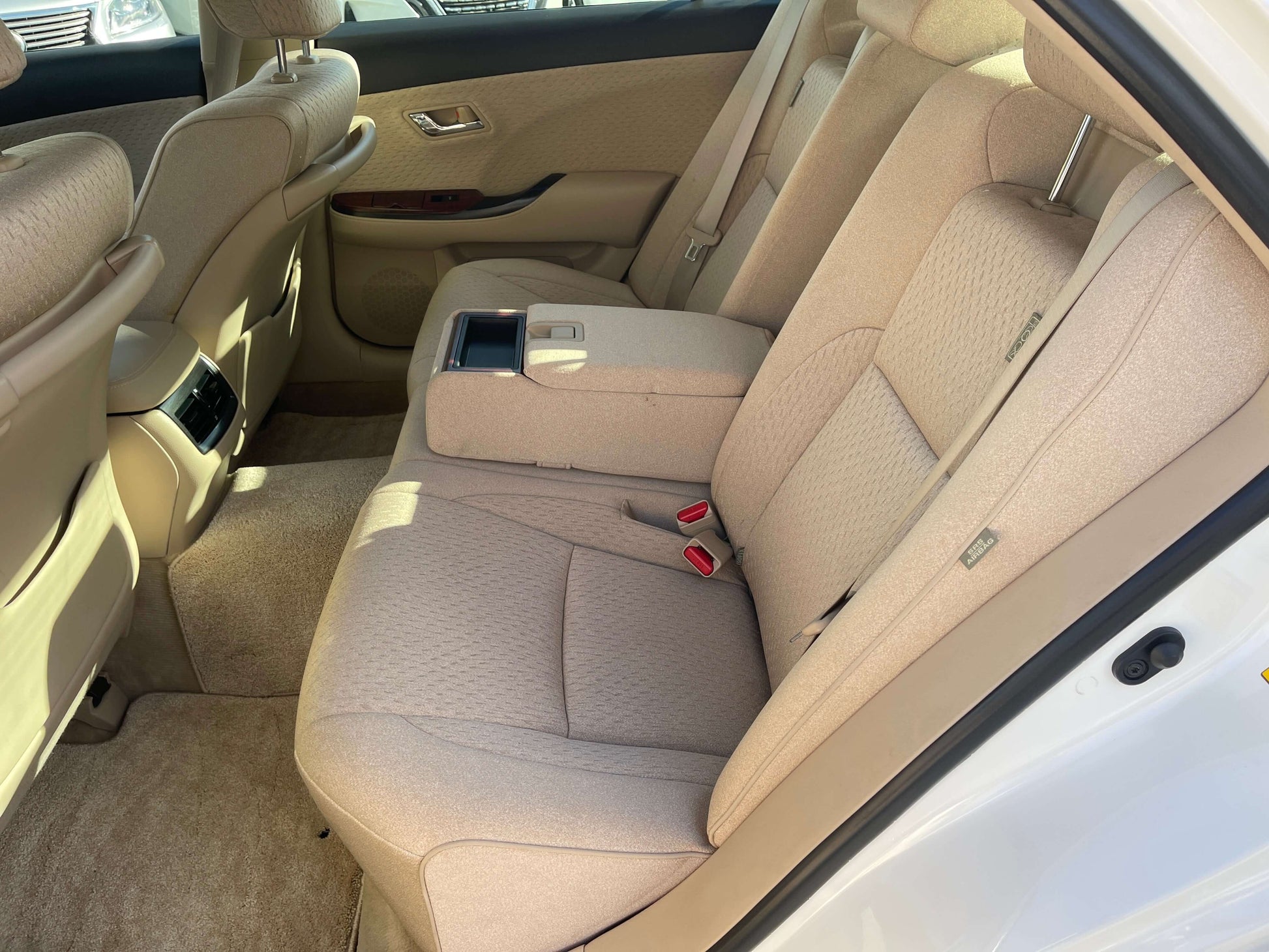 Interior back seat view of the 2008 Toyota Crown V6 3.0L Royal Saloon Luxury Sedan showing spacious seating.