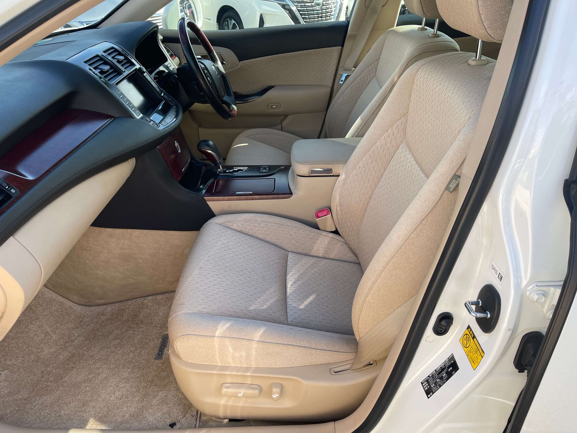 Interior view of the 2008 Toyota Crown V6 3.0L Royal Saloon Luxury Sedan showing spacious beige seating.
