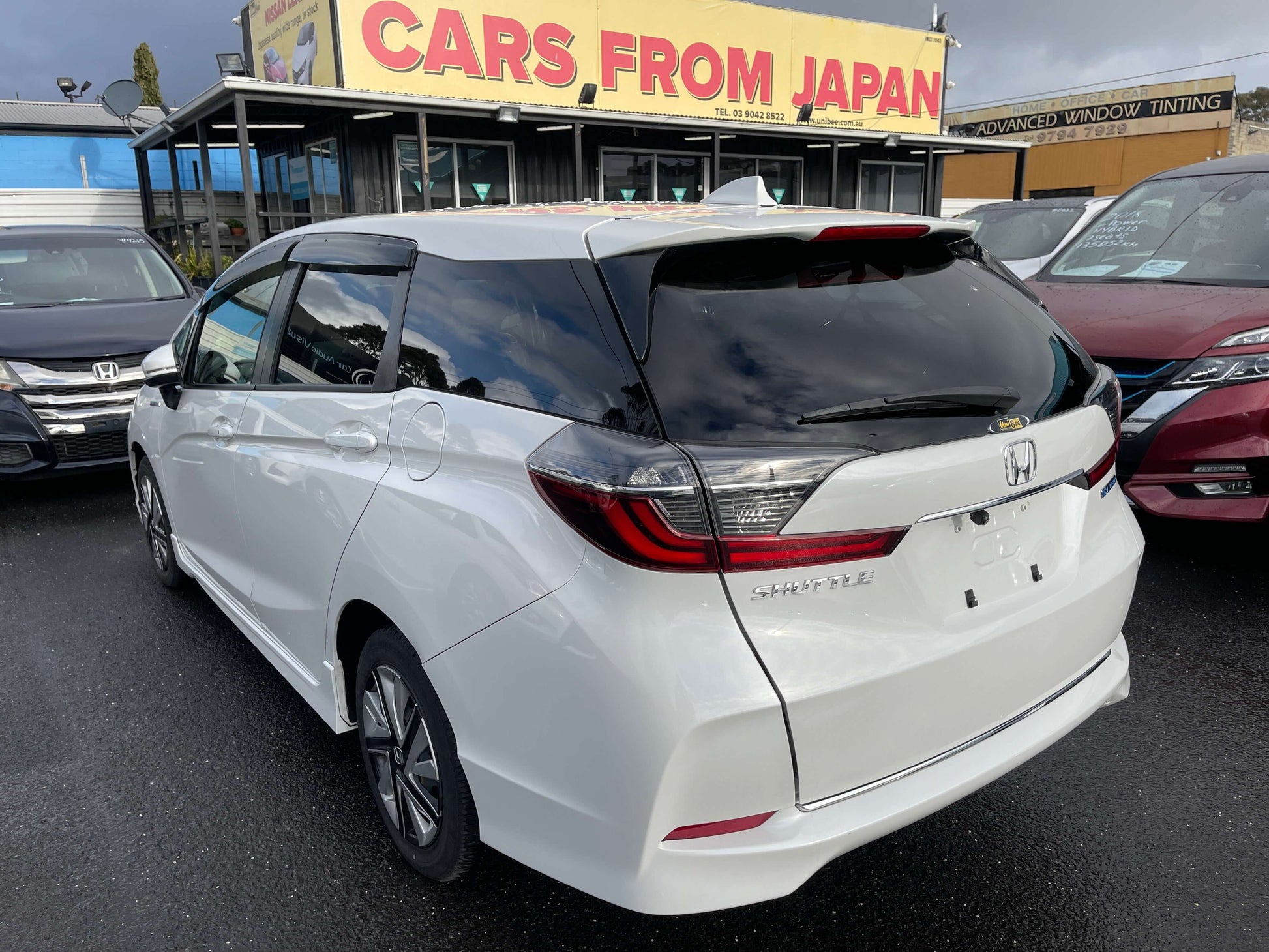 2021 Honda Shuttle Hybrid X Honda Sensing Edition rear view in front of Cars From Japan dealership.