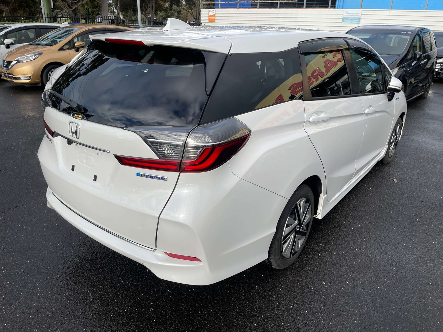 2021 Honda Shuttle Hybrid X Honda Sensing Edition rear view showing sleek design and modern features.