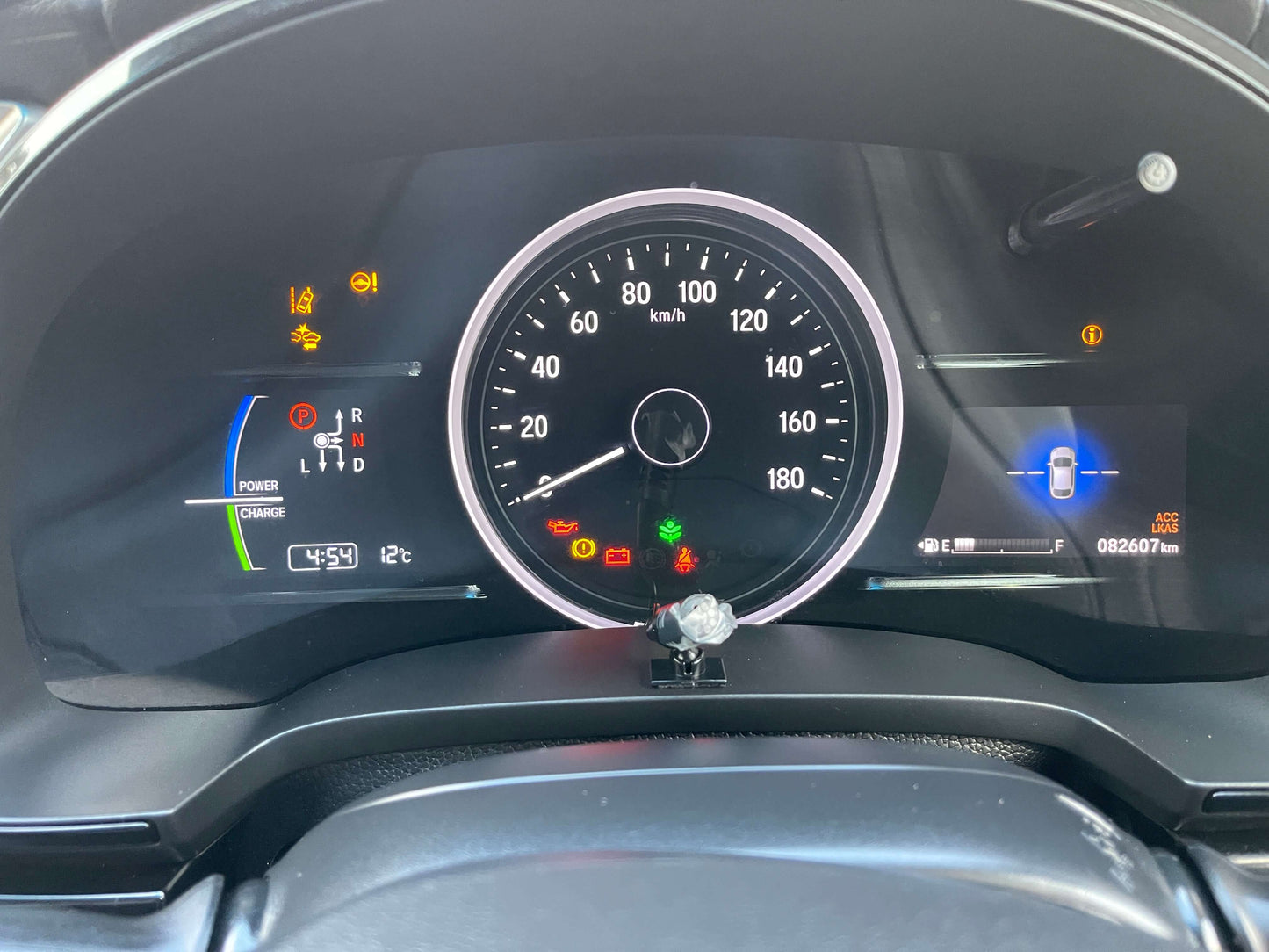2021 Honda Shuttle Hybrid dashboard with speedometer and indicators, showing mileage of 82607 km.