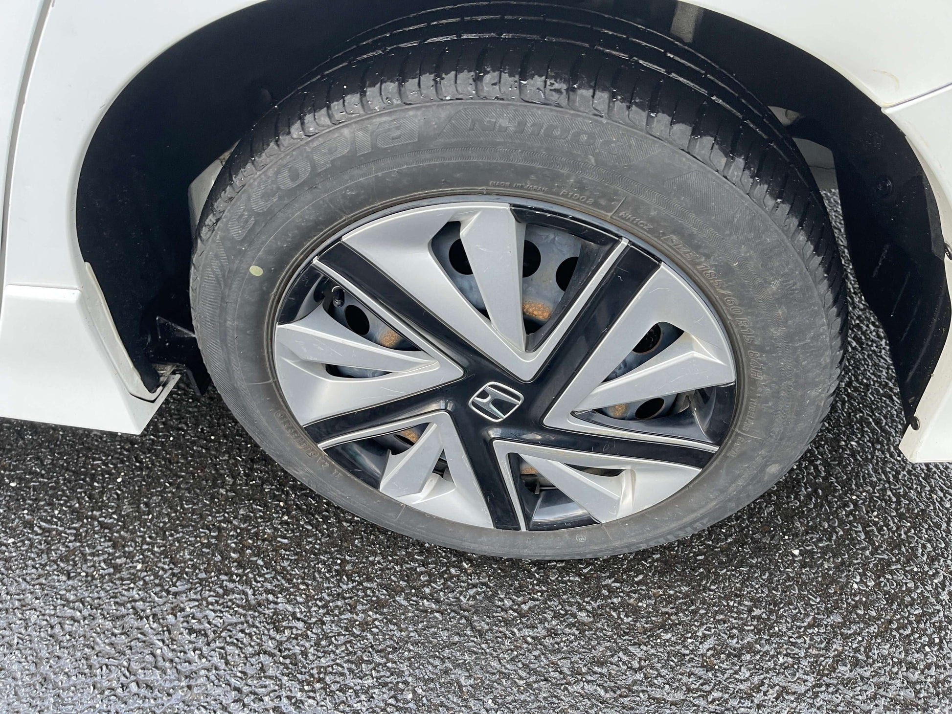 Close-up of a tire and alloy wheel of the 2021 Honda Shuttle Hybrid X Honda Sensing Edition 5 seater.