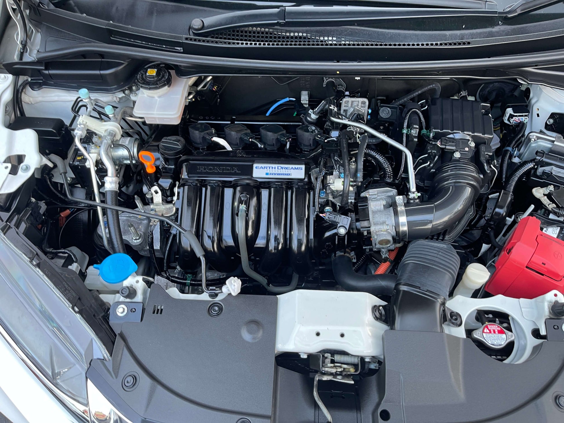 2021 Honda Shuttle Hybrid engine bay view showcasing the hybrid system and components.