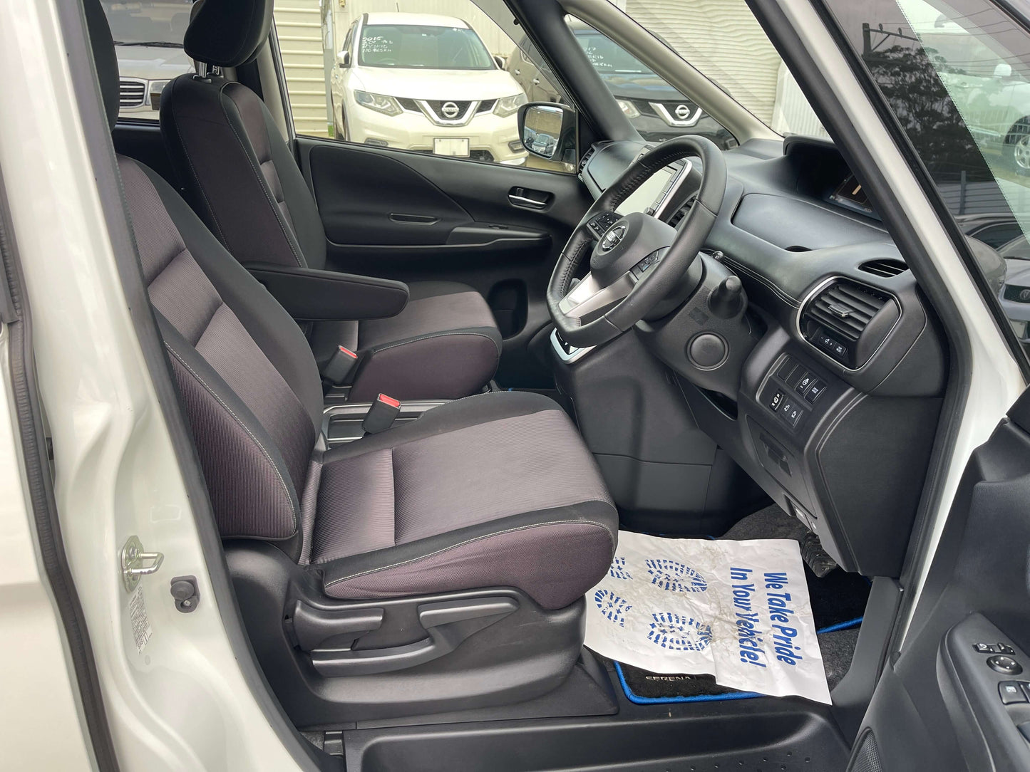 Interior view of 2018 Nissan Serena 1.2 e-Power Highway Star V with spacious seating and dashboard.