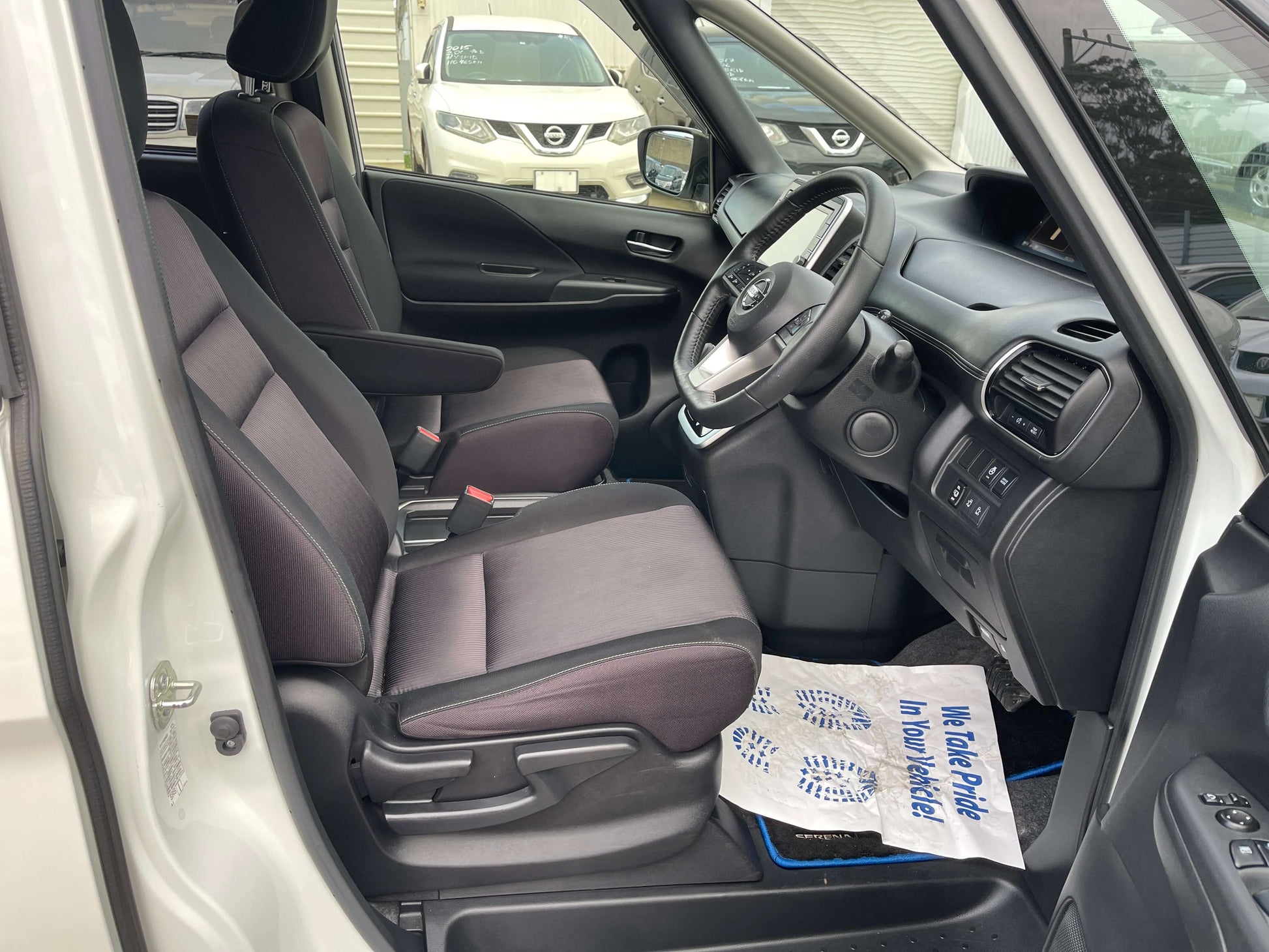 Interior view of 2018 Nissan Serena 1.2 e-Power Highway Star V with spacious seating and dashboard.